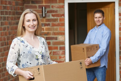 Family home relocation service with moving truck and packed boxes