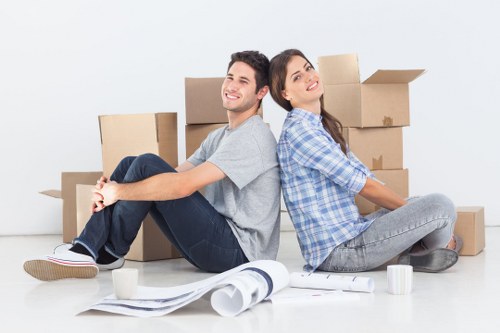 Removal team transporting furniture with care in a van