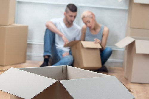 Furniture and fragile items being carried carefully during a local move