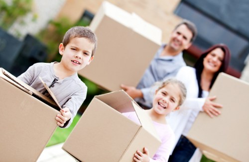 Movers navigating a stairway during a local furniture collection
