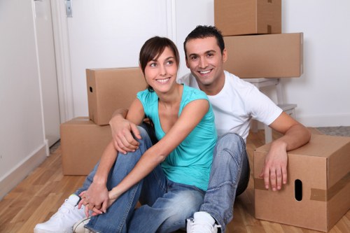 Office furniture being moved through a commercial building in Movers