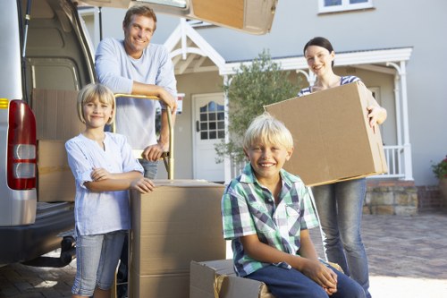 Prepared packed boxes and furniture for collection by a local moving team