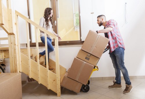 Man with van movers preparing items for secure delivery