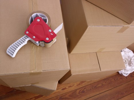Mover handling office equipment during a local business move