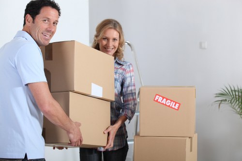 Insured man and van movers handling items carefully