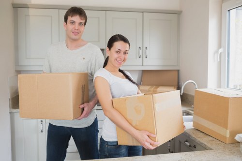 Packed moving boxes and furniture loaded into a removal truck
